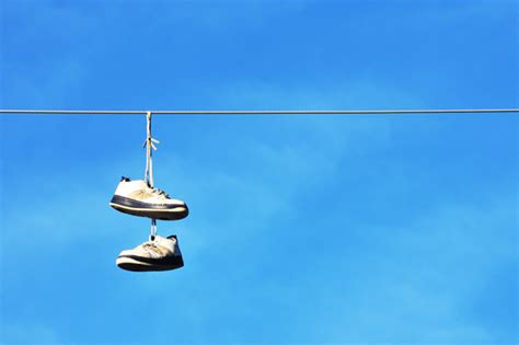 sneakers on power lines|sneakers over power lines meaning.